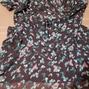 Billowy Torrid top has shoulder cutout and straps